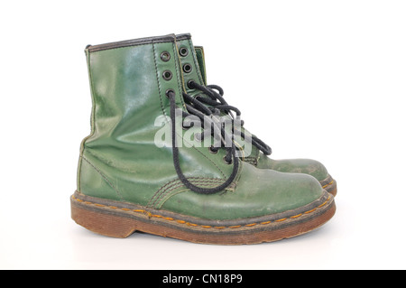Pair of dirty green worn out shoes Stock Photo