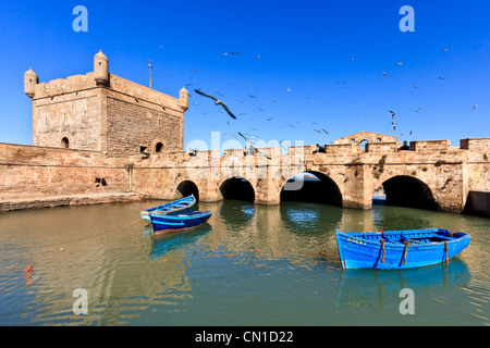 Fort Essaouira and fishing boats in the harbor at Essaouira, Morocco Stock Photo