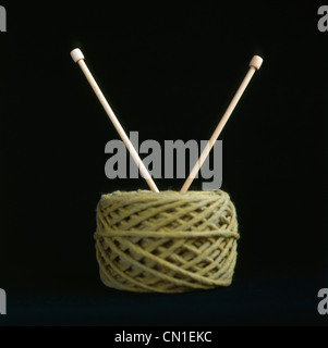 Color knitting yarn with needles on white background Stock Photo - Alamy