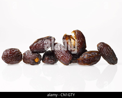 Several Medjool Dates on White Background Stock Photo
