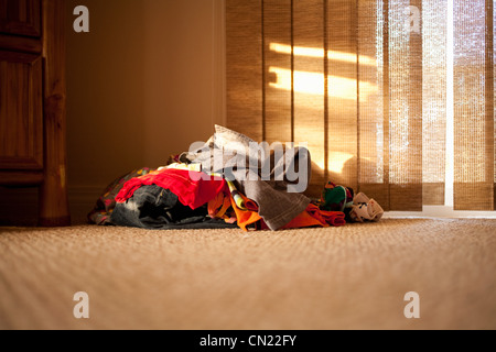 Pile of clothes on floor Stock Photo