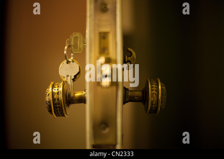 Keys in hotel room door Stock Photo