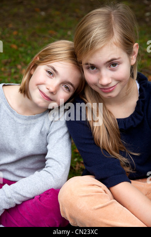 Portrait of two girls smiling Stock Photo - Alamy