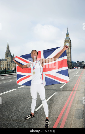 Olympic gold medal winner with Union Jack Stock Photo