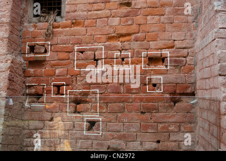 Marks on the wall where bullets struck inside Jallianwala Bagh in Amritsar in Punjab, India; a massacre carried out in 1919 Stock Photo