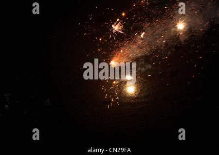 Fireworks exploding at night Stock Photo