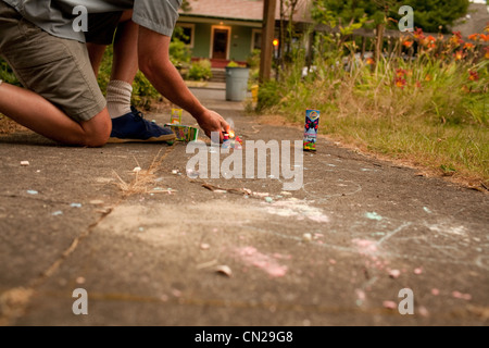 Man lighting fireworks Stock Photo