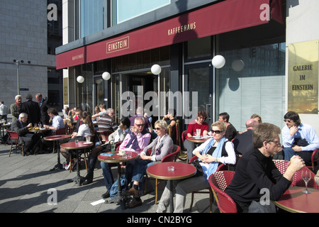 Busy street cafe at famous Cafe Einstein on Unter den Linden in Berlin Germany Stock Photo