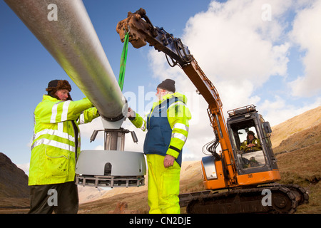 3 wind turbines being constructed behind the kirkstone Pass Inn on kirkstone Pass in the Lake District, UK. Stock Photo