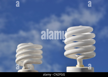 Save energy bulb against sky Stock Photo