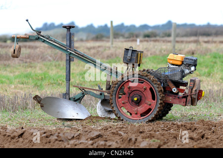 Walking tractor, Two-wheel tractor, Ploughing, plough. Stock Photo