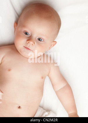 baby boy in diaper on white, blue eye Stock Photo