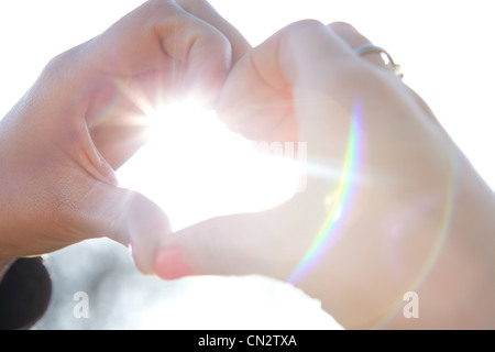 Hands making heart shape Stock Photo