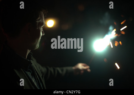 Man holding sparkler Stock Photo