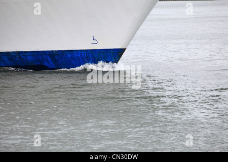 Tug boat bow creating spray outdoor sea - Cruise ship details Stock Photo