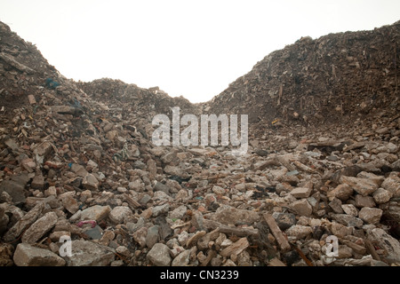 Rocks by a landfill site Stock Photo - Alamy