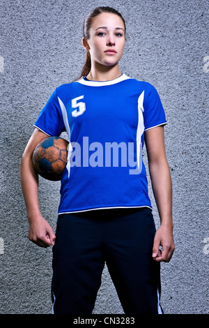 Portrait of young woman holding handball Stock Photo