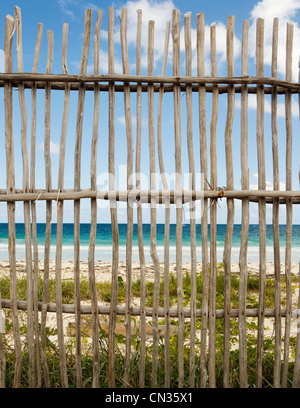 Wooden fence by beach Stock Photo