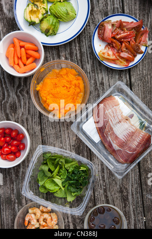 Selection of food on picnic table Stock Photo