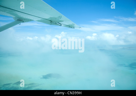 Airplane over the sea, Ambergris Caye, Belize Stock Photo