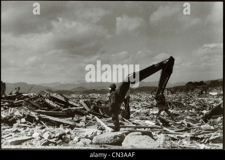 Rikuzentakata, Japan- 20th March 2011: Soldier amongst debris in aftermath of the 2011 Tohoku Earthquake and Tsunami Stock Photo