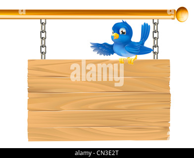 Cute bluebird sitting on hanging sign showing what it says with his wing Stock Photo