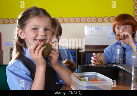School children eating packed lunches Stock Photo