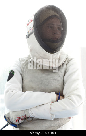 Female fencer in mask Stock Photo