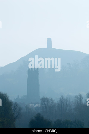 The tower of St John's Church with the ruin of St Michael's Church on Glastonbury Tor in the Distance. Somerset. England. Stock Photo