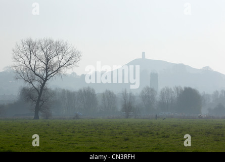 The tower of St John's Church with the ruin of St Michael's Church on Glastonbury Tor in the Distance. Somerset. England. Stock Photo