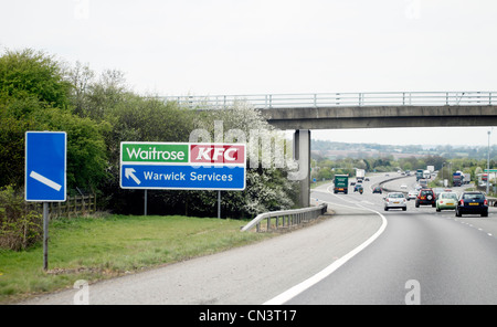 Motorway sign on the M40 for Warwick services - KFC and Waitrose Stock Photo