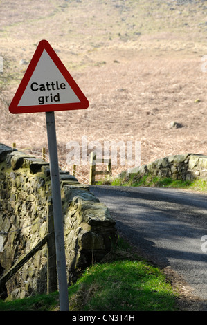 cattle grid and cattle grid warning sign Stock Photo - Alamy