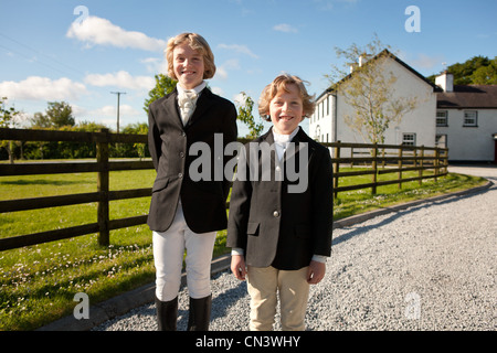 Portrait of boys wearing horse riding clothes Stock Photo