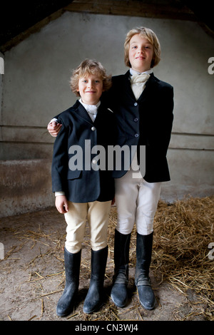 Portrait of boys wearing horse riding clothes Stock Photo