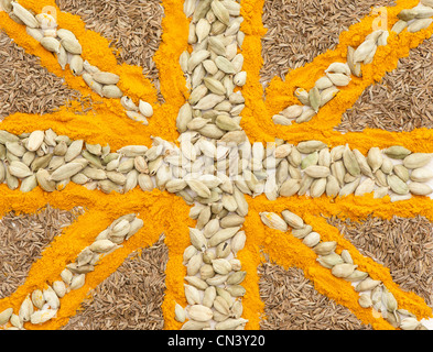 Union Flag created out of curry spices: whole cumin seeds, cardamom pods and turmeric Stock Photo