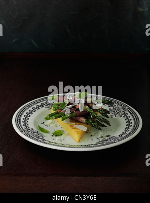 grilled polenta with asparagus wrapped in parma ham Stock Photo