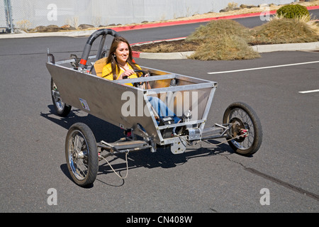 A member of the Heliocentric Electric Car team drives an experimental race car powered by solar power in Bend, Oregon Stock Photo