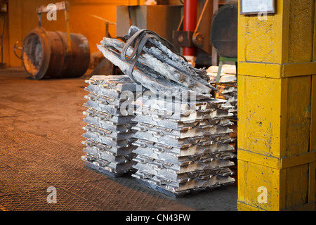 Aluminum bricks on non-ferrous metallurgical plant. Russian metallurgy factory. Grey metal Stock Photo