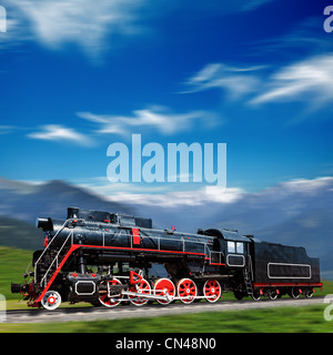 Speeding old locomotive in mountains Stock Photo