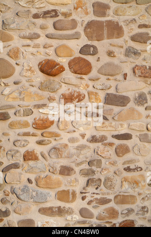 Rustic stone wall of an old farm house in Italy Stock Photo