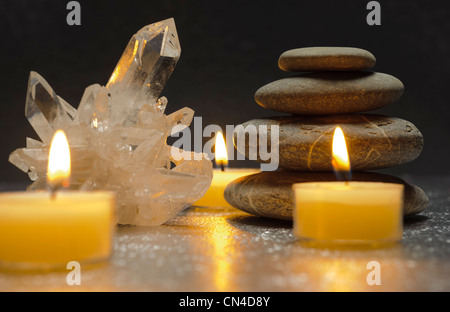 quartz crystal and zen stones with candles Stock Photo