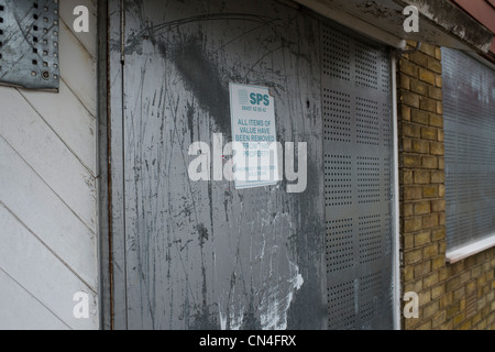 Boarded up shops and flats on a notorious sink estate in Basildon Essex. Due for regeneration before the recession struck. Stock Photo