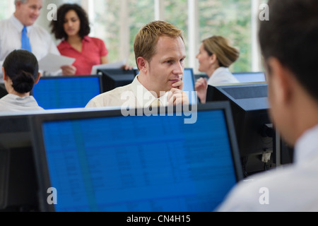 Office worker using computer in office Stock Photo