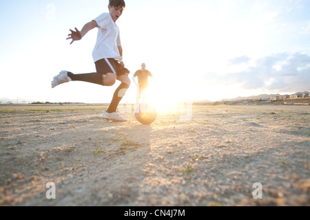 Boy playing soccer Stock Photo