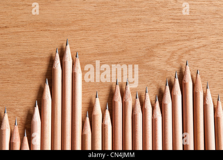 Wooden pencils in a row Stock Photo