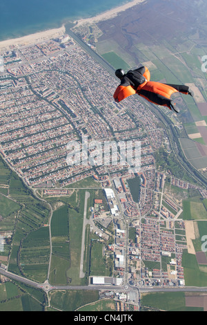 Man wingsuit flying over Empuriabrava, Spain Stock Photo