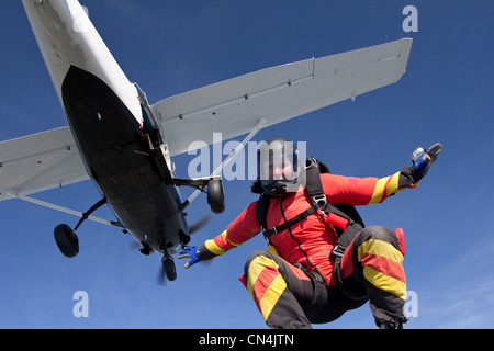 Woman freefly skydiving from airplane Stock Photo