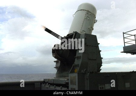 A Close-In Weapon System (CIWS) fires during a Pre-Aim Calibration (PAC) fire aboard the amphibious assault ship USS Essex (LHD 2). CIWS is the self-defense system that combines a 20mm Gatling gun with search and tracking radar to provide surface ships with terminal defense against anti-ship missiles. Essex is the NavyÕs only forward deployed amphibious assault ship and is the flagship for the Essex Expeditionary Strike Group out of Sasebo, Japan Stock Photo