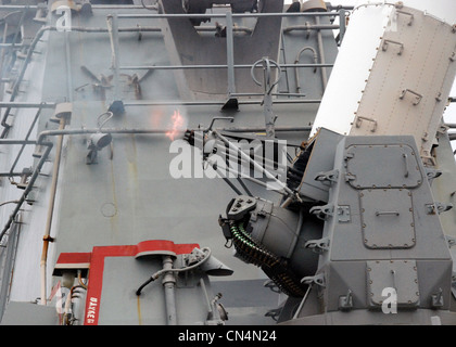 The close-in weapon system (CIWS) fires from the aft mount aboard guided-missile destroyer USS Mitscher (DDG 57) during live firing exercises. The firing exercises were conducted during the Team Work South phase of Partnership of the Americas (POA) 2007. POA is focusing on enhancing relationships with partner nations through a variety of exercises and events at sea and on shore throughout South America, Latin America, and the Caribbean. Stock Photo