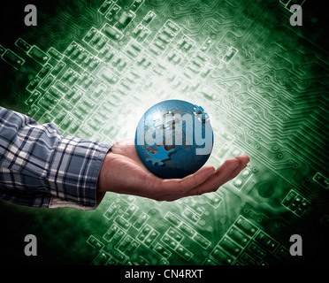 holding a glowing earth globe in his hands Stock Photo